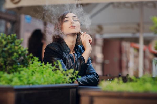 1.happy-woman-smoking-with-electronic-cigarette